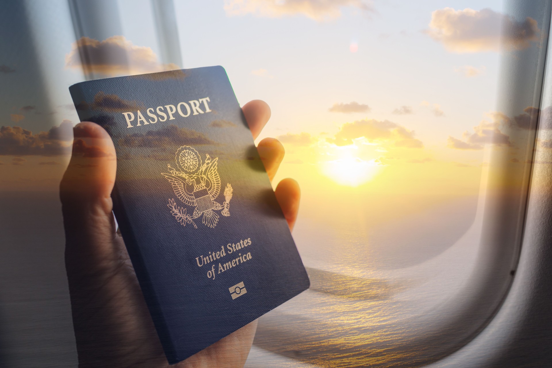 Traveler holding USA passport. Holiday, summer, vacation.